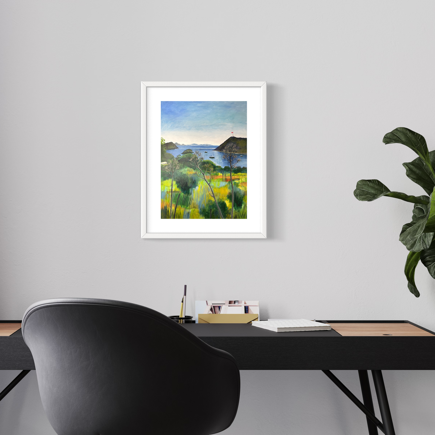 After the Rain landscape by Elaine Boylan. View from Gümüşlük on the Bodrum Peninsula in Turkey. Pale blue sky over the Aegean sea, hill with flag pole flying the Turkish flag, field in the foreground, Greek islands in the distance. Colours are mainly greens, golds and blues. High quality giclée print on fine art paper with mount/mat and white frame. Print is shown in a contemporary home office above a desk.
